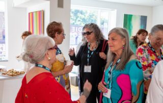 Group of women networking at Baycrest’s Artists in the Spotlight tour.